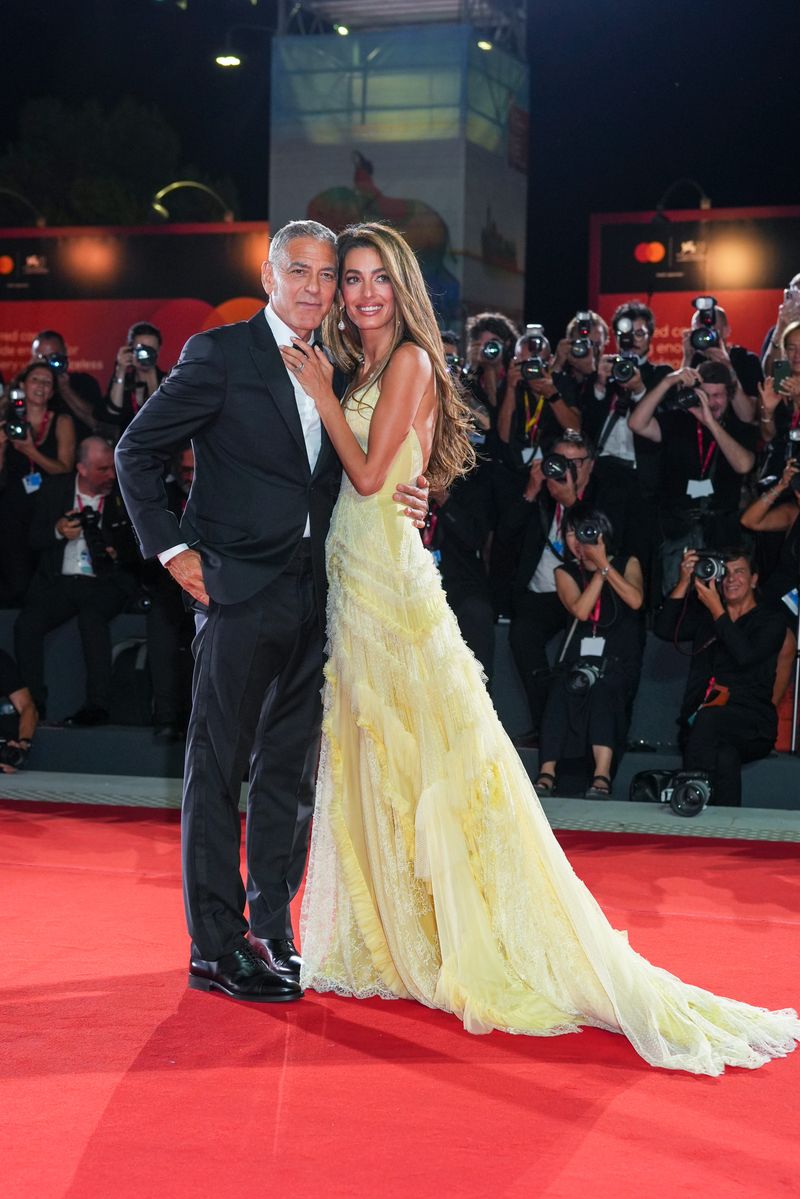 George Clooney and Amal Clooney attend the Wolfs red carpet during the 81st Venice International Film Festival on September 1, 2024 in Venice, Italy. 