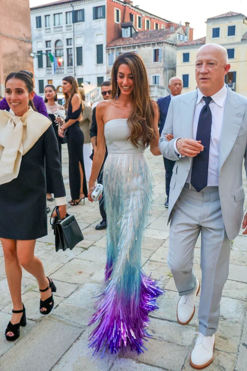 Amal Clooney arrives at the Cartier private party in Venice with a chic and elegant dress