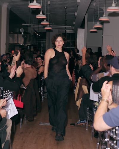 Musician King Princess walking the "runway" at Eckhaus Latta's dinner event.