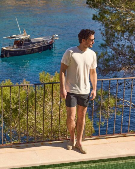 man in a summer outfit by the sea