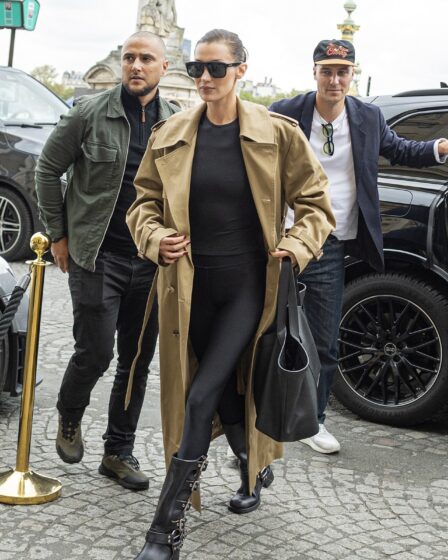 Image may contain Bella Hadid Clothing Coat Footwear Shoe Accessories Bag Handbag Glasses Hat Adult and Person