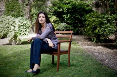 Francoise Bettencourt Meyers sitting in a garden.