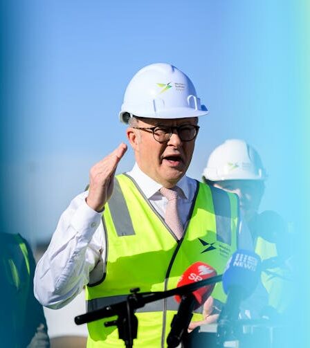 Albanese in yellow high-vis.