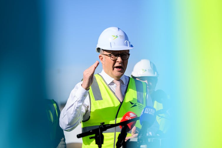 Albanese in yellow high-vis.