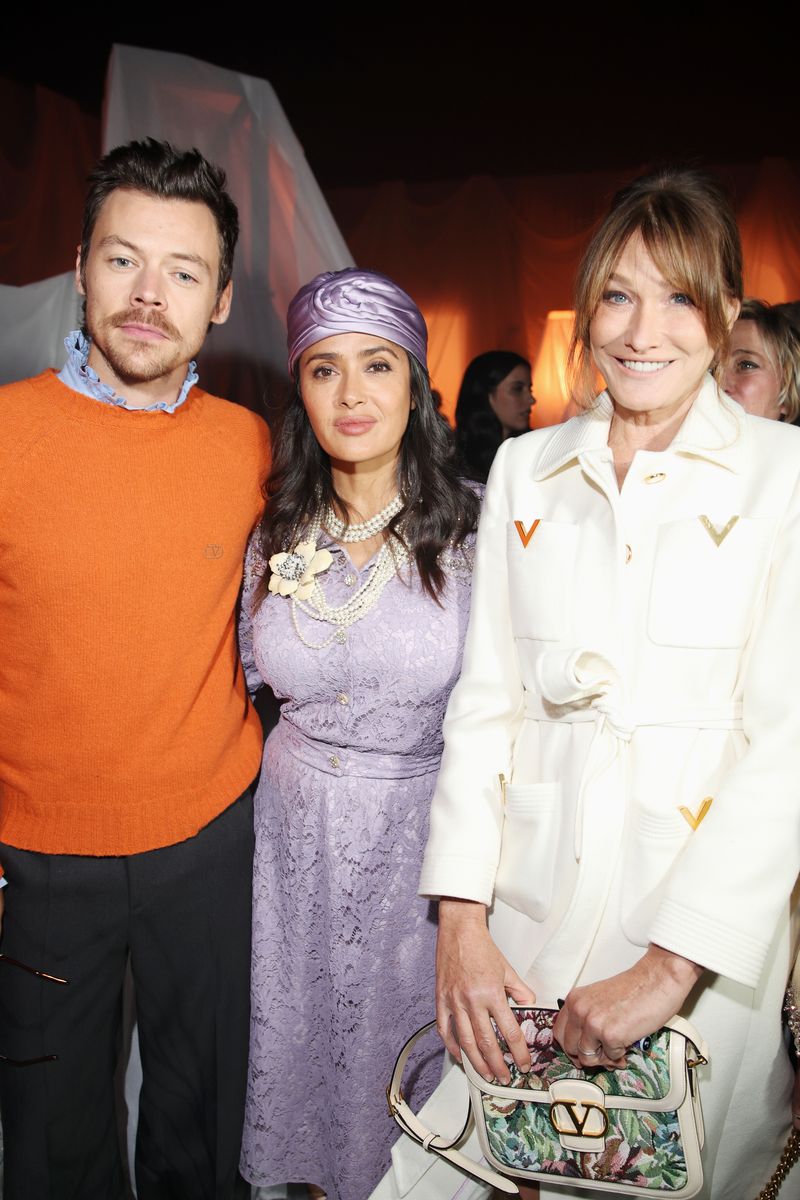 PARIS, FRANCE - SEPTEMBER 29: Harry Styles, Salma Hayek and Carla Bruni attend Valentino Pavillon des Folies Show as part of the Paris Fashion Week on September 29, 2024 in Paris, France. (Photo by Daniele Venturelli/Getty Images for Valentino)