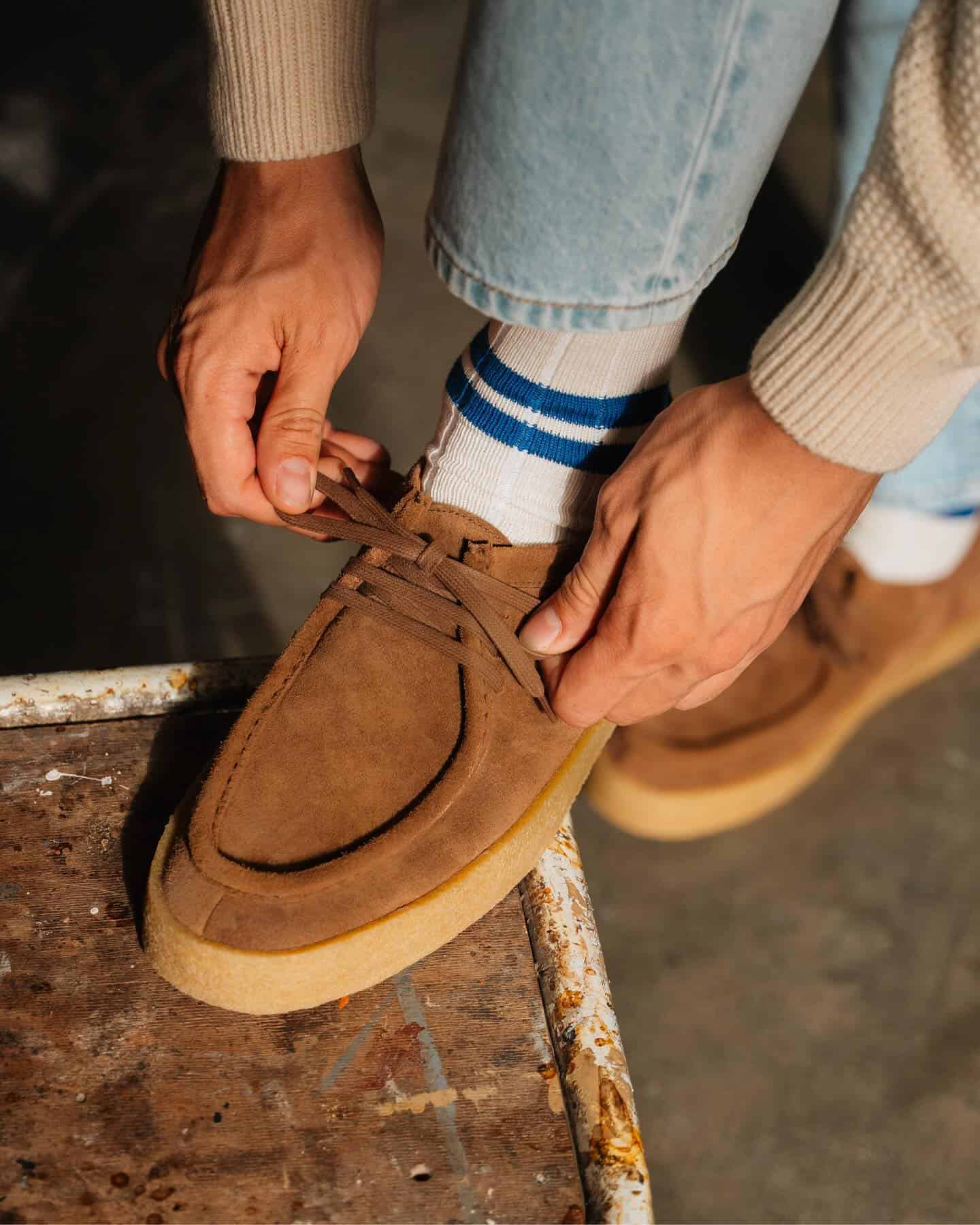 man tying his shoelace