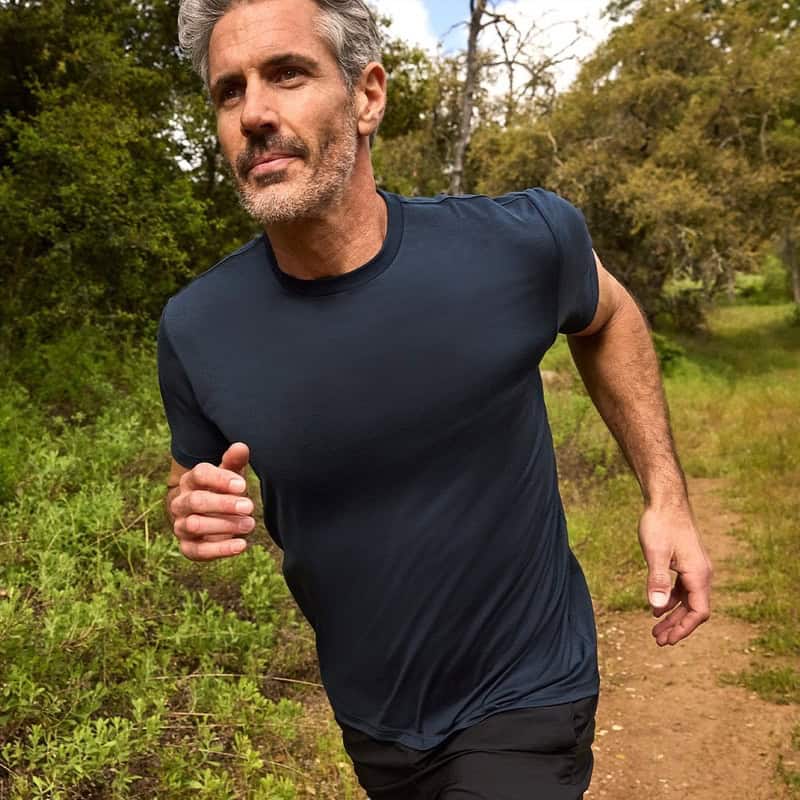 man jogging wearing a dark grey crew neck t-shirt