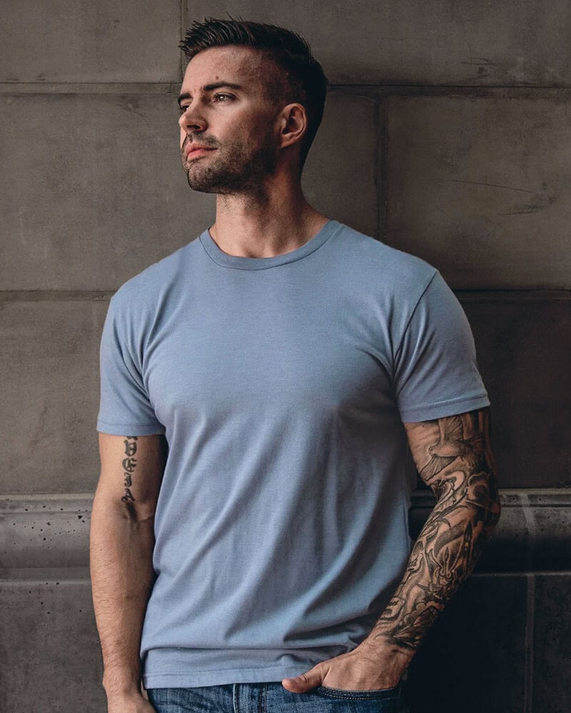 man in a grey crew neck t-shirt by Fresh Clean Threads