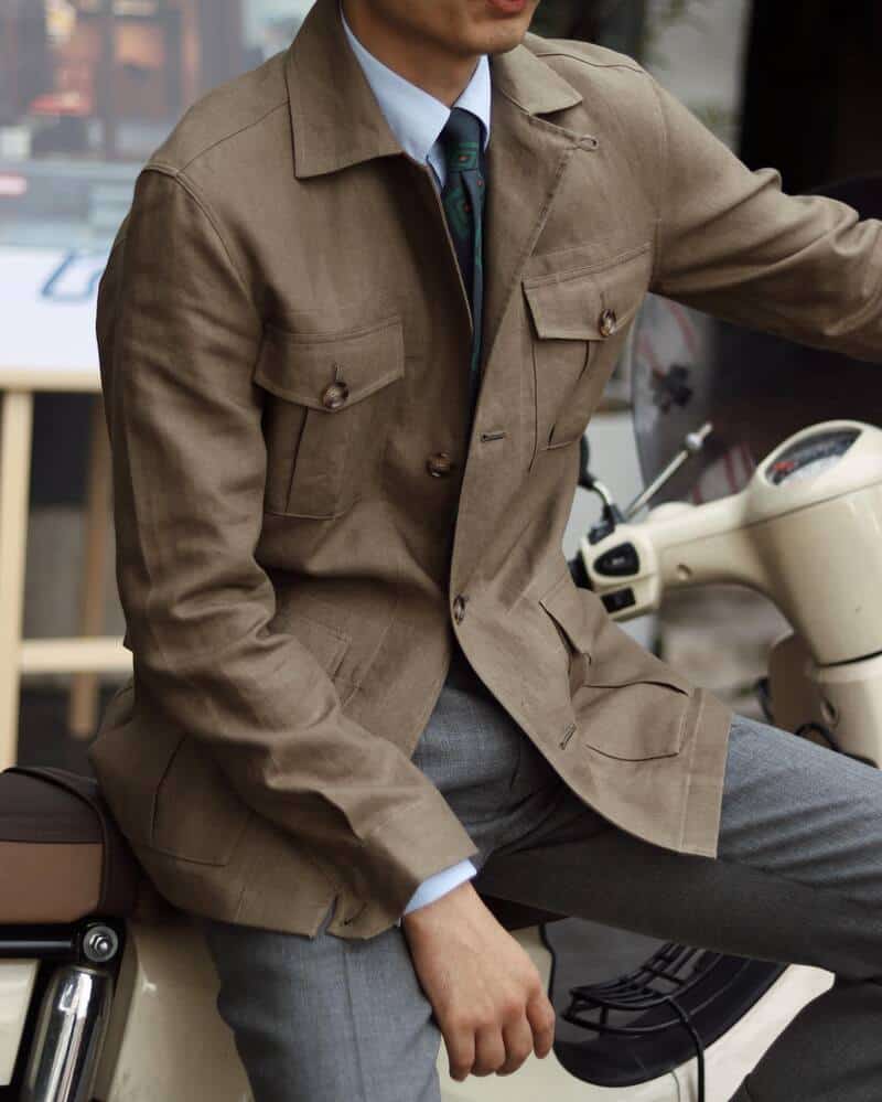 man sitting on a scooter wearing a Kajetan Safari Jacket by TheJacket Maker