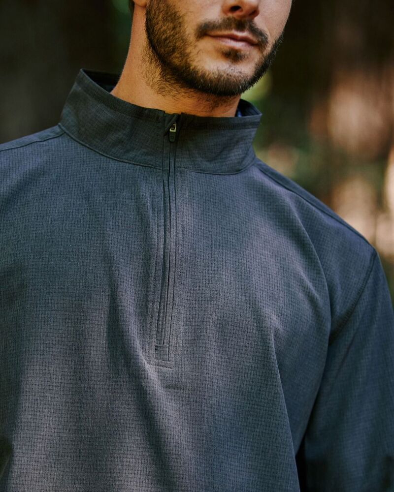 man wearing a dark grey Oxygenate Quarter-Zip Pullover by 7diamonds