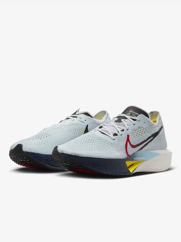 pair of nike running sneakers with a red outline swoosh