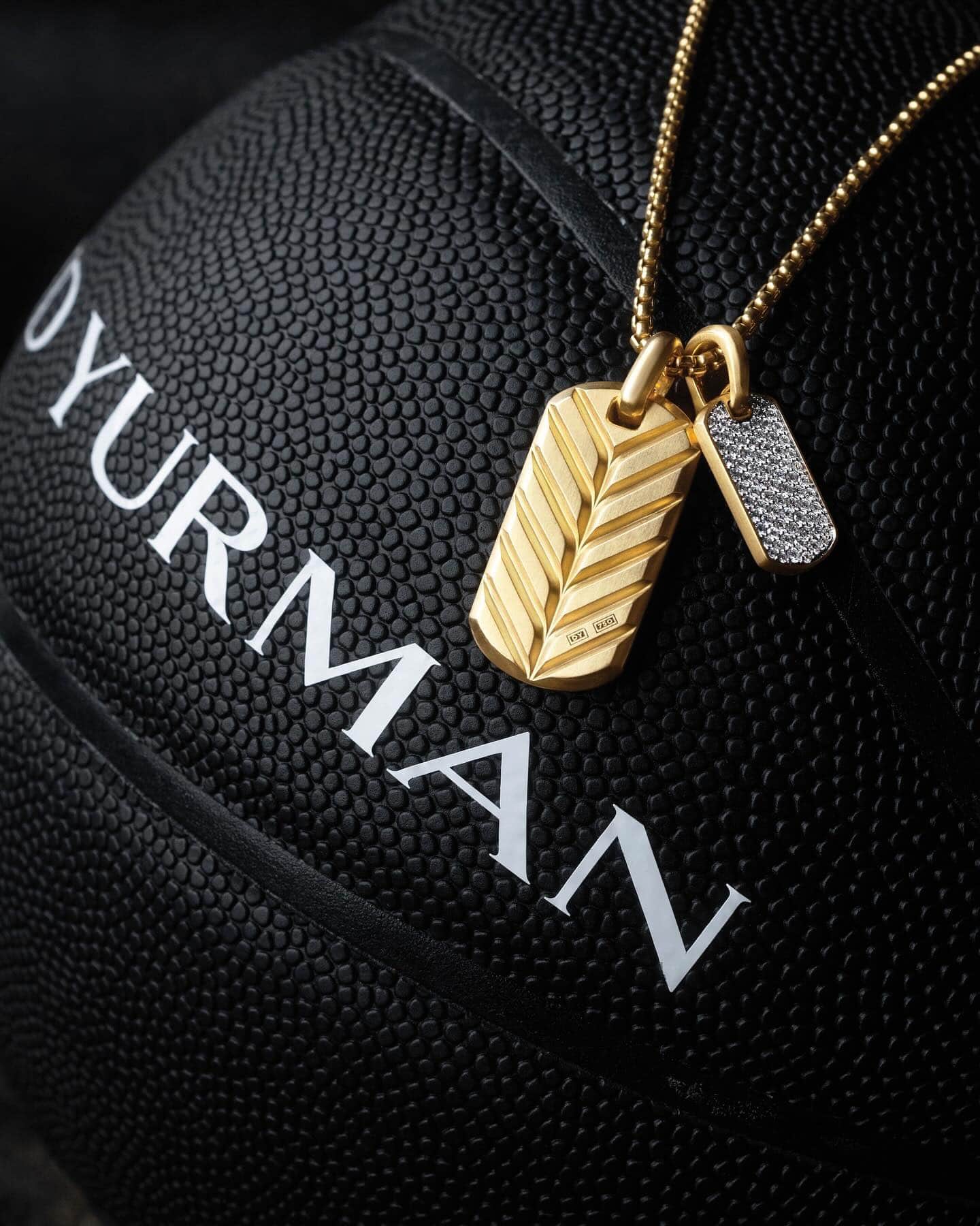 tag pendant necklace and a black basketball by david yurman