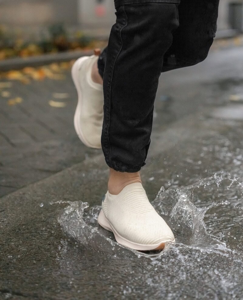 running with a Beige Move Slip-On Sneakers by Vessi