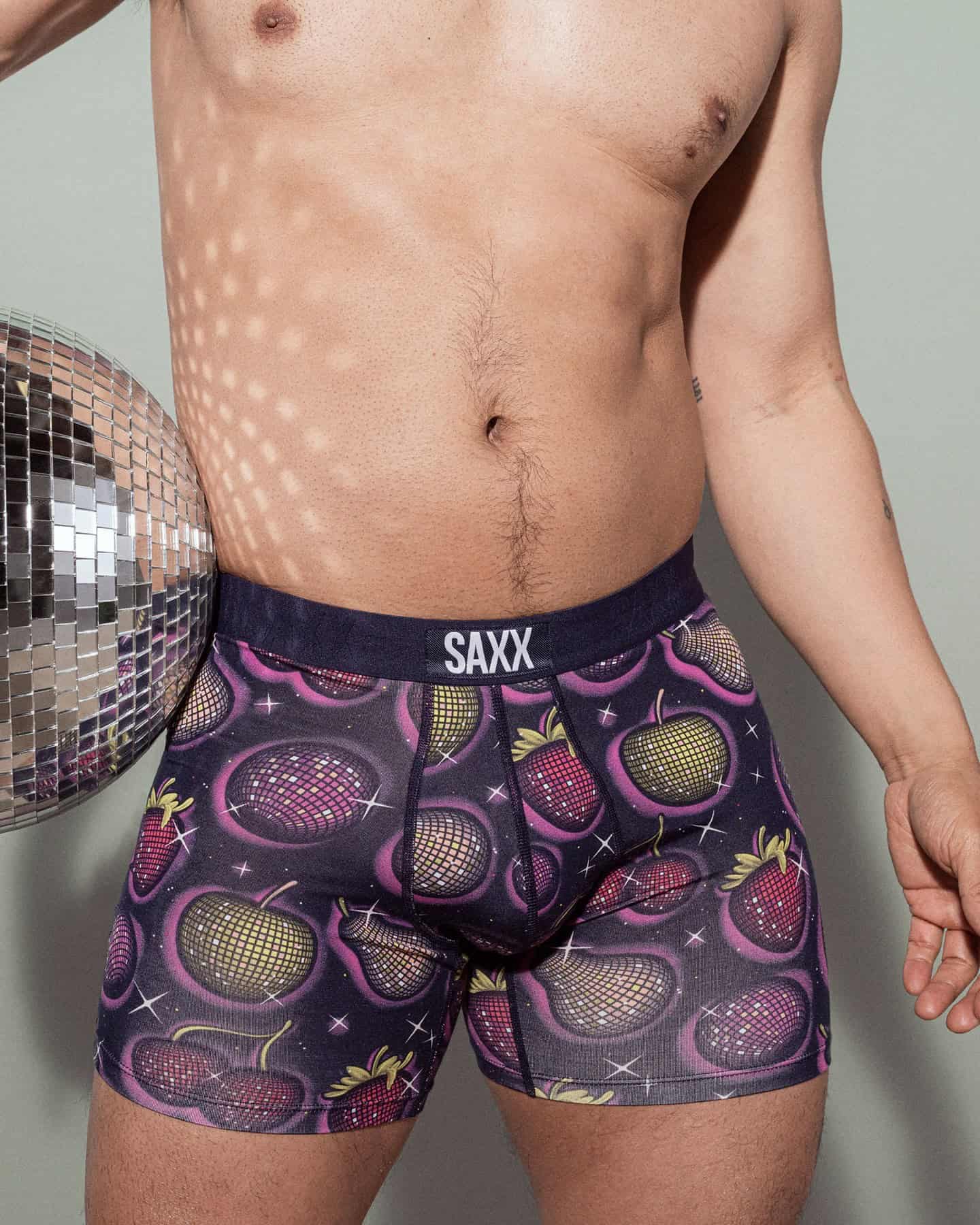 man wearing a boxer brief with disco ball print by Saxx