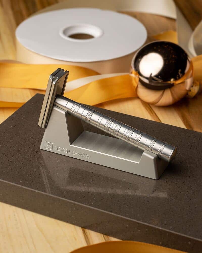 the Henson Double Edge Safety Razor on a stand