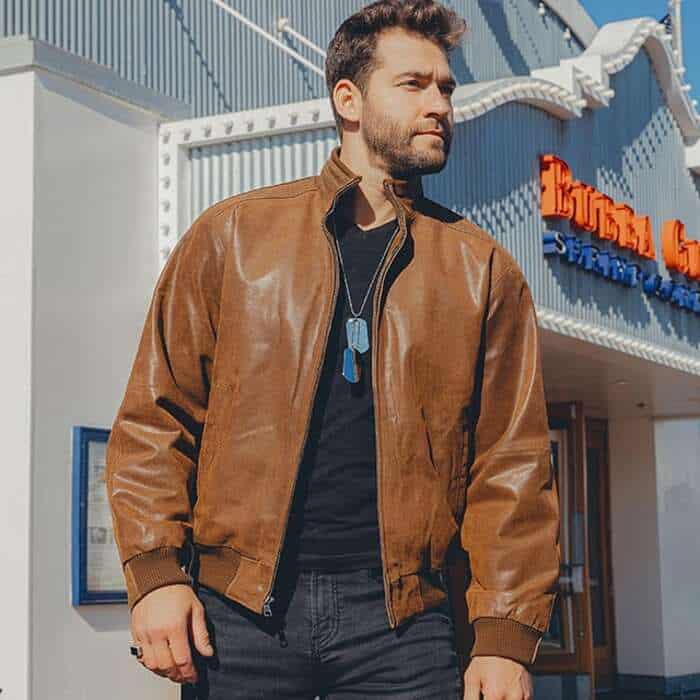 man wearing a leather bomber jacket by flavor