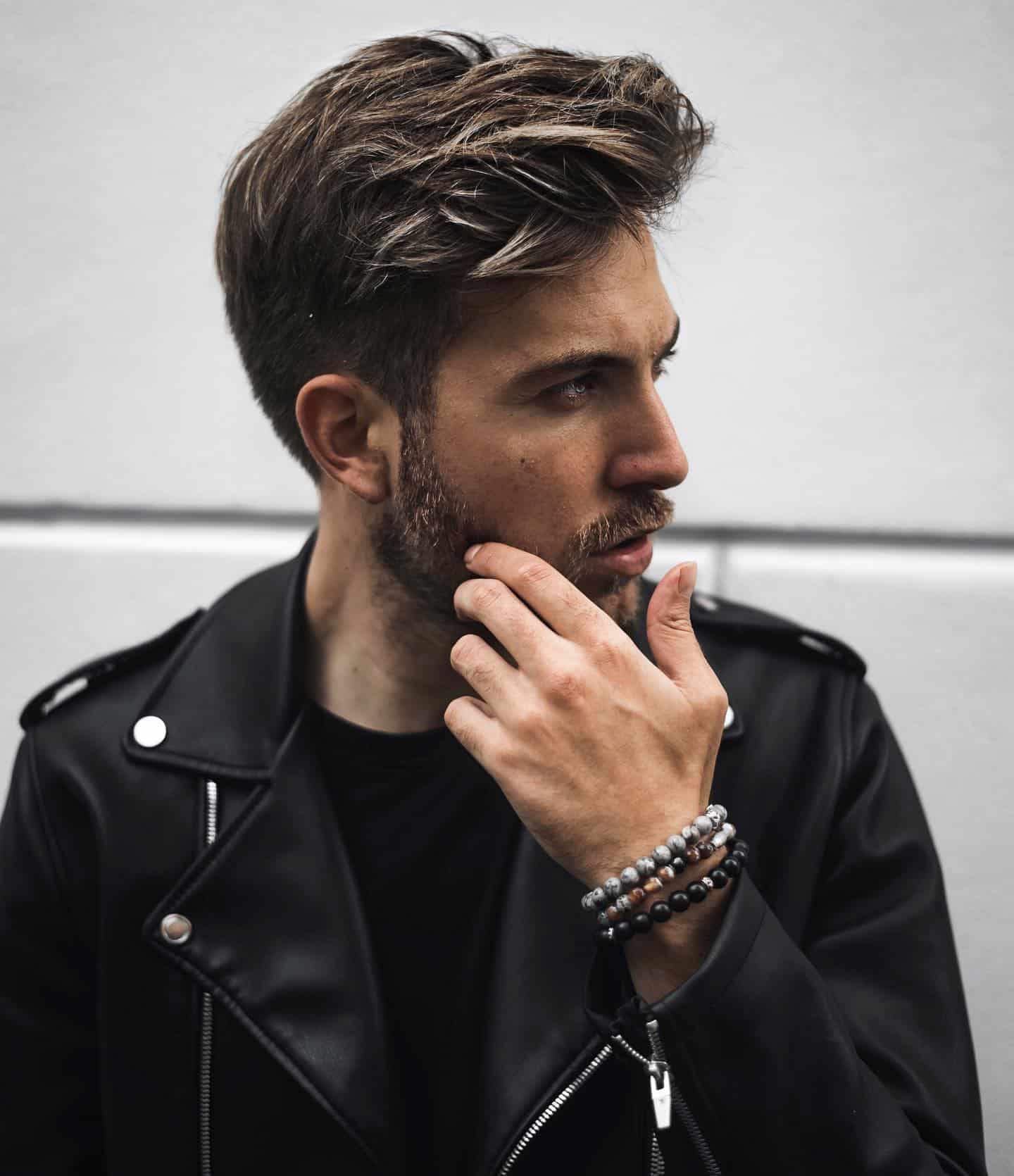 man wearing a set of beaded bracelets