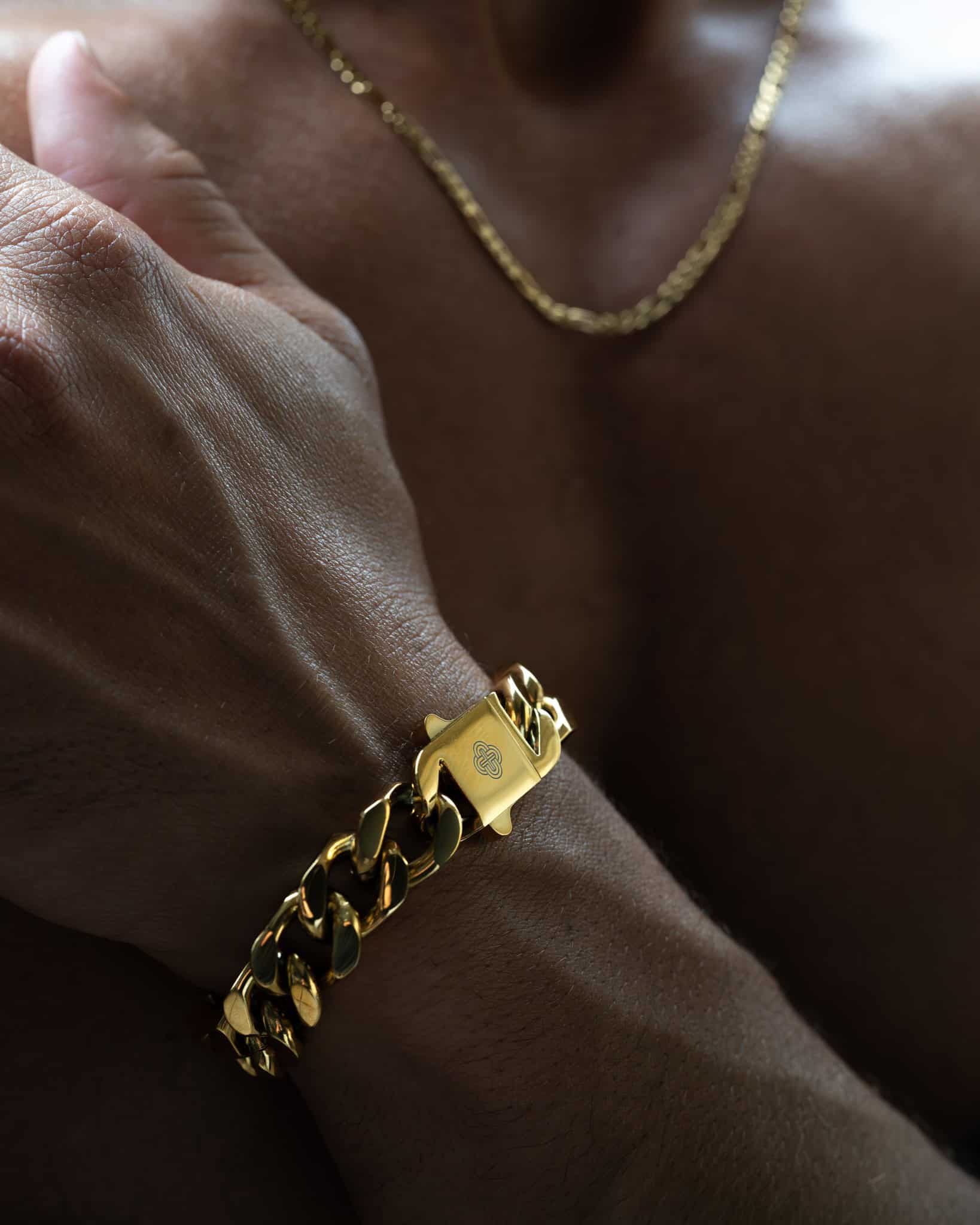 man wearing a thick chain bracelet