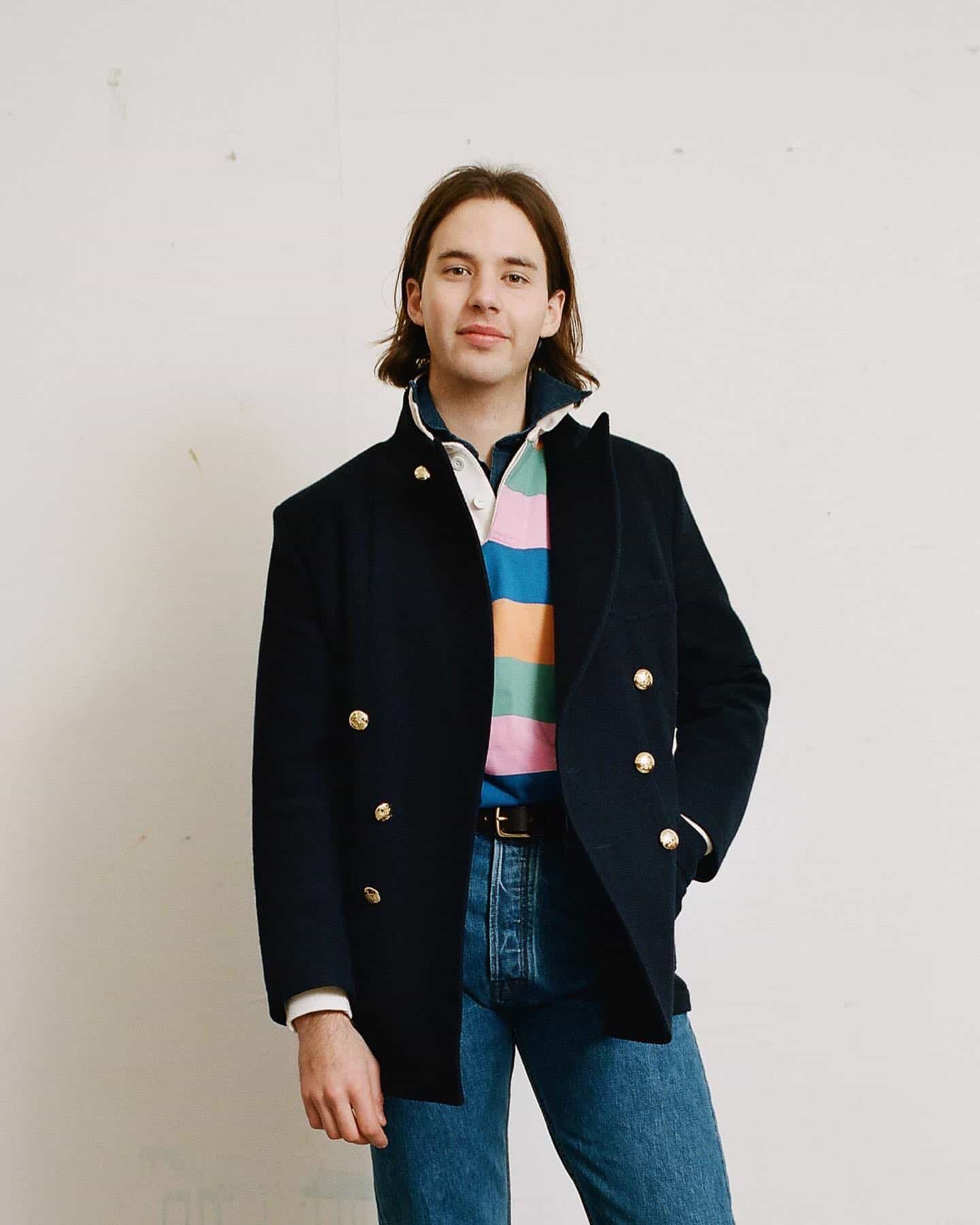 man in a navy double breasted blazer