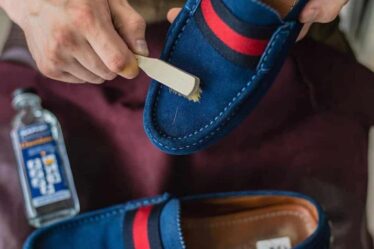 cleaning a suede shoe with a brush