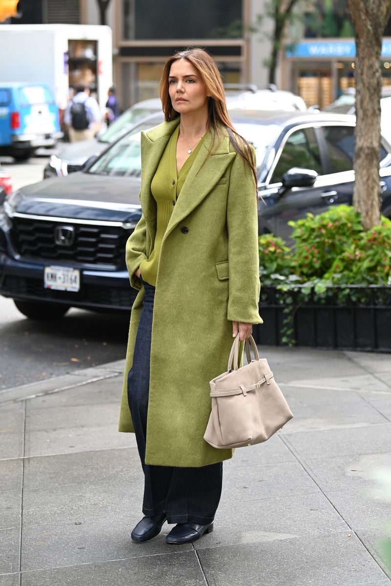 Katie Holmes looks stylish in a matching green coat and top whilst out in New York City