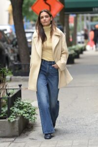 Image may contain Katie Holmes Clothing Pants Jeans Coat Adult Person Blazer Jacket Footwear and Shoe