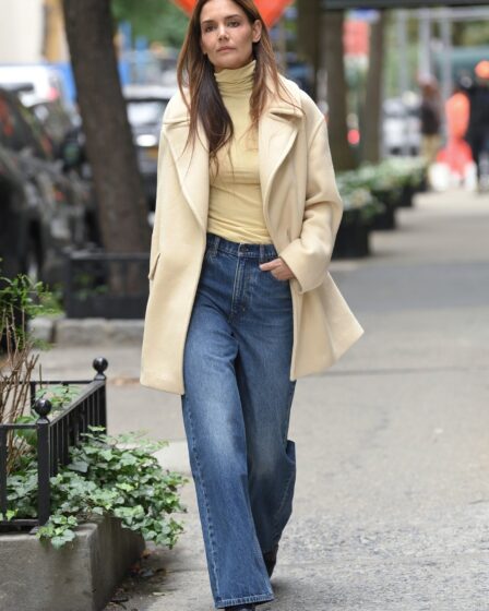 Image may contain Katie Holmes Clothing Pants Jeans Coat Adult Person Blazer Jacket Footwear and Shoe