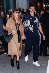 Image may contain Travis Kelce Taylor Swift Alexa Curtis Accessories Bag Handbag Clothing Footwear and High Heel