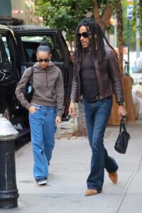 Image may contain Lenny Kravitz Zoë Kravitz Clothing Pants Accessories Bag Handbag Jeans Pedestrian and Person