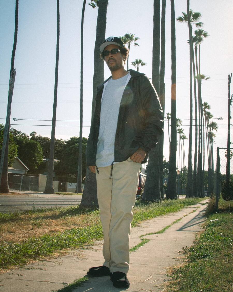 man on the sidewalk wearing the Shaka Classic Nylon Windbreaker