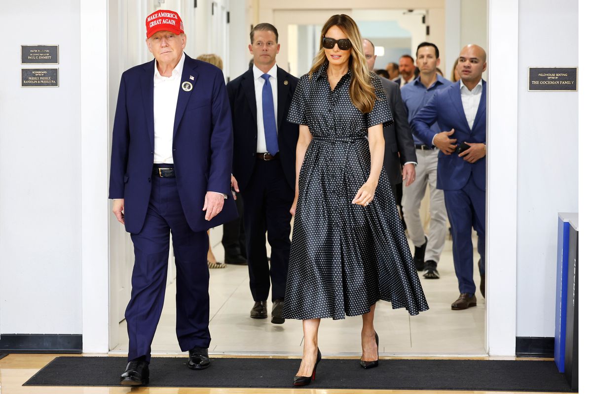 Donald Trump and his wife Melania Trump depart after casting their votes at a polling place 