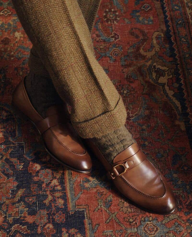 wearing brown pants and socks and brown monk-strap shoes