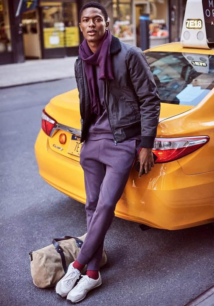 man in purple joggers and scarf