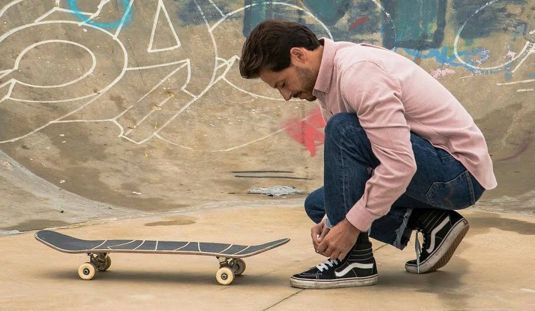 man tying his shoelace