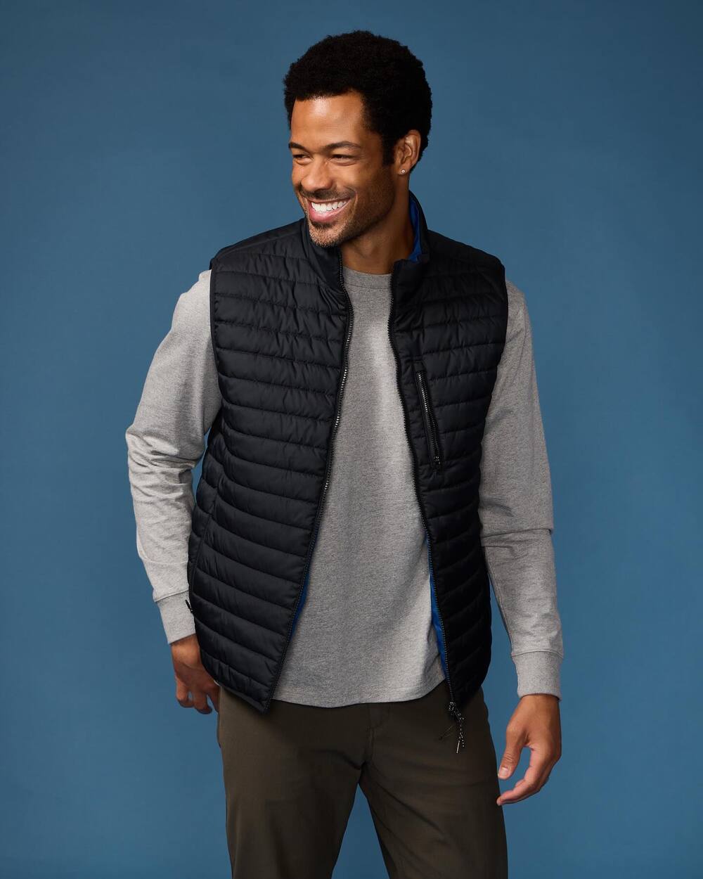 man wearing the Skechers Go Shield Reversible Vest