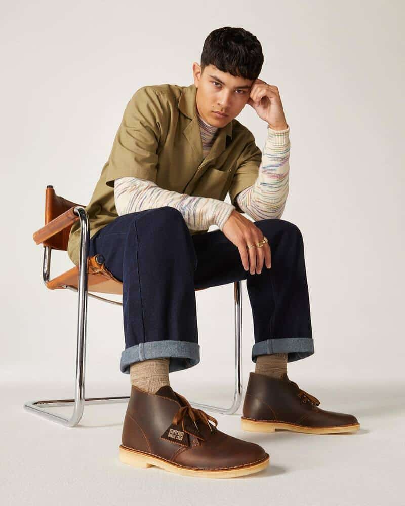 man sitting on a chair wearing the beeswax leather boots