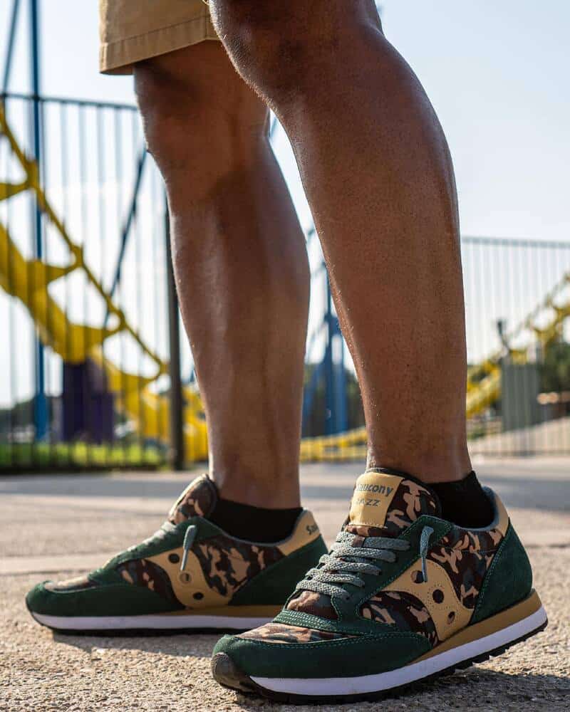 man wearing a pair of Saucony Jazz sneakers in Camo