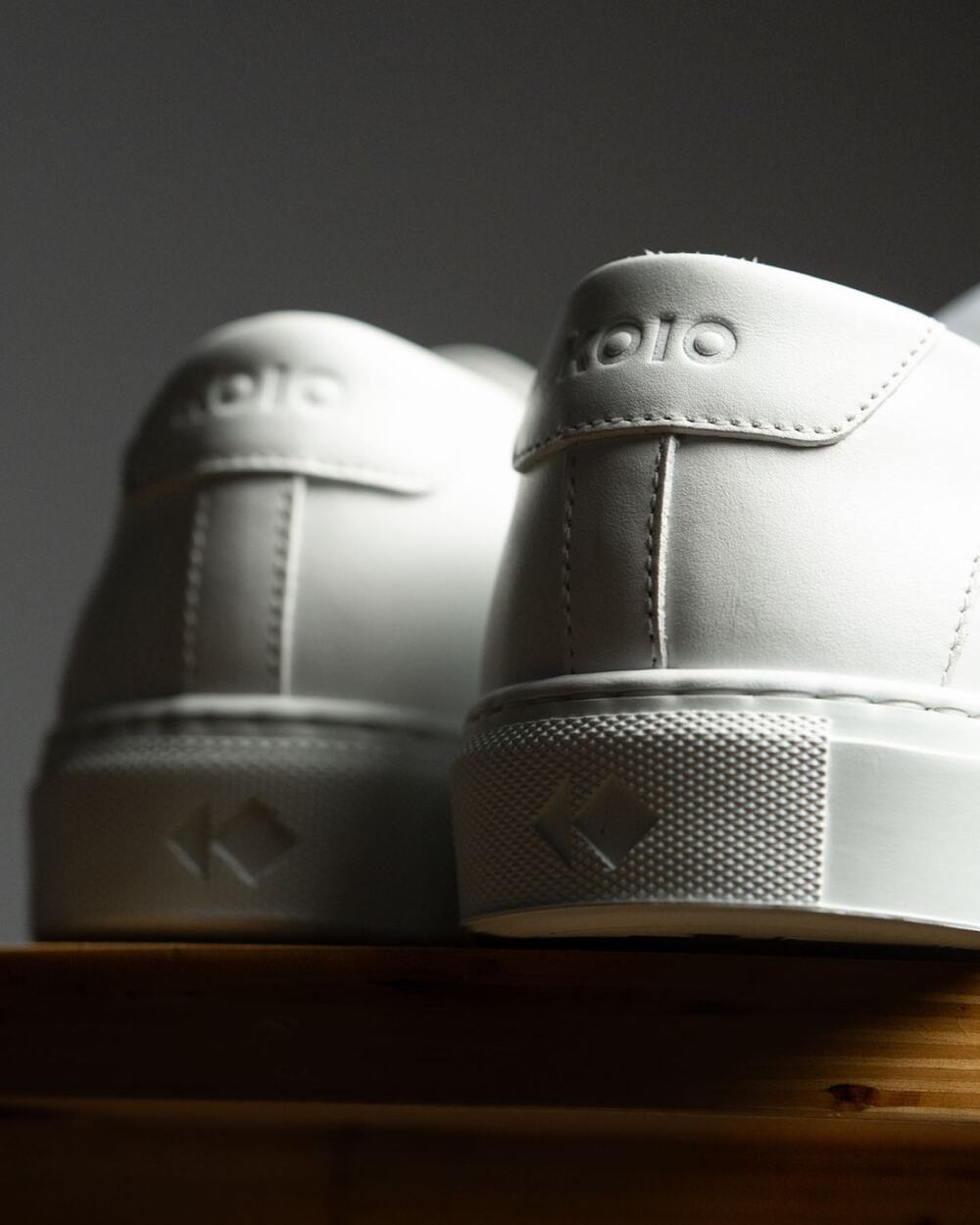 a pair of white leather KOIO Sneakers