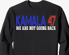 A black sweatshirt with the words Kamala 47 We Are Not Going Back written on it.