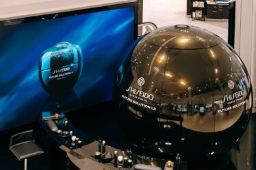 In the middle of the 34th street Macy's store's beauty floor is a car-sized orb wrapped in black and gold Shiseido branding, flanked by makeup counters.