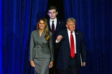 Donald Trump arrives for an election night event alongside Melania Trump and his son Barron Trump