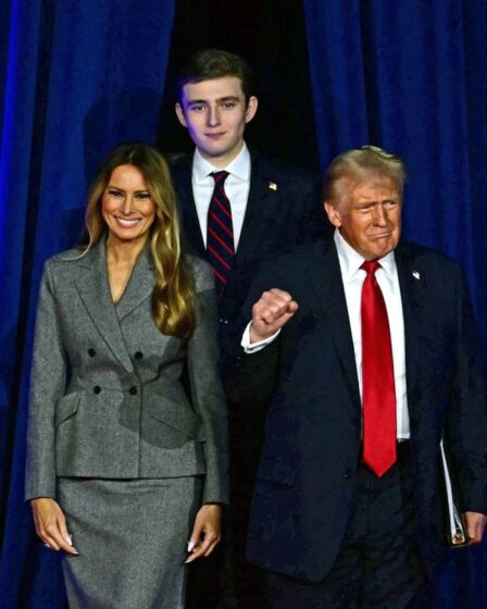 Donald Trump arrives for an election night event alongside Melania Trump and his son Barron Trump