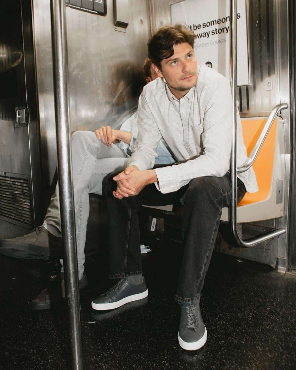 man sitting inside a train