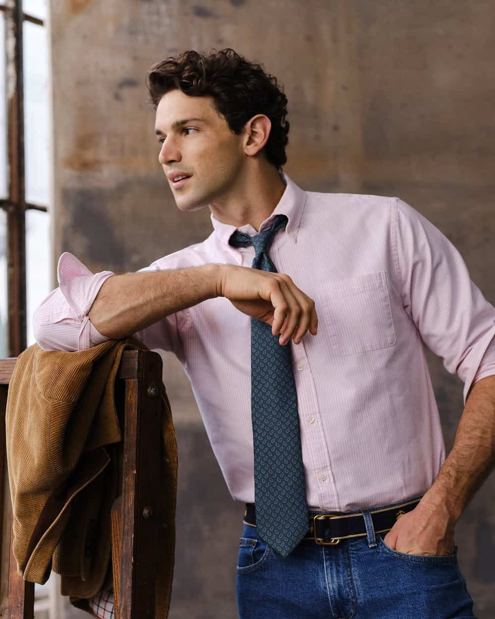 man wearing a pink shirt and blue tie