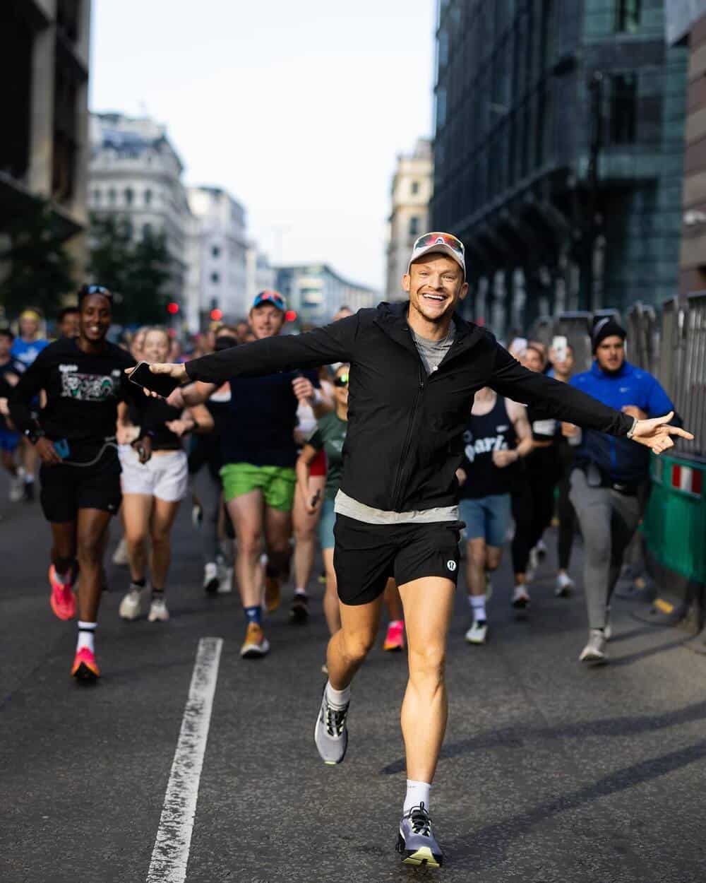 man running wearing a black jacket