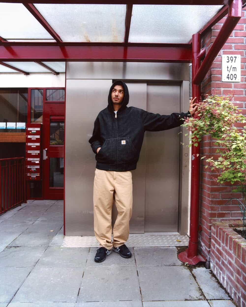 man wearing a hoodie and brown pants