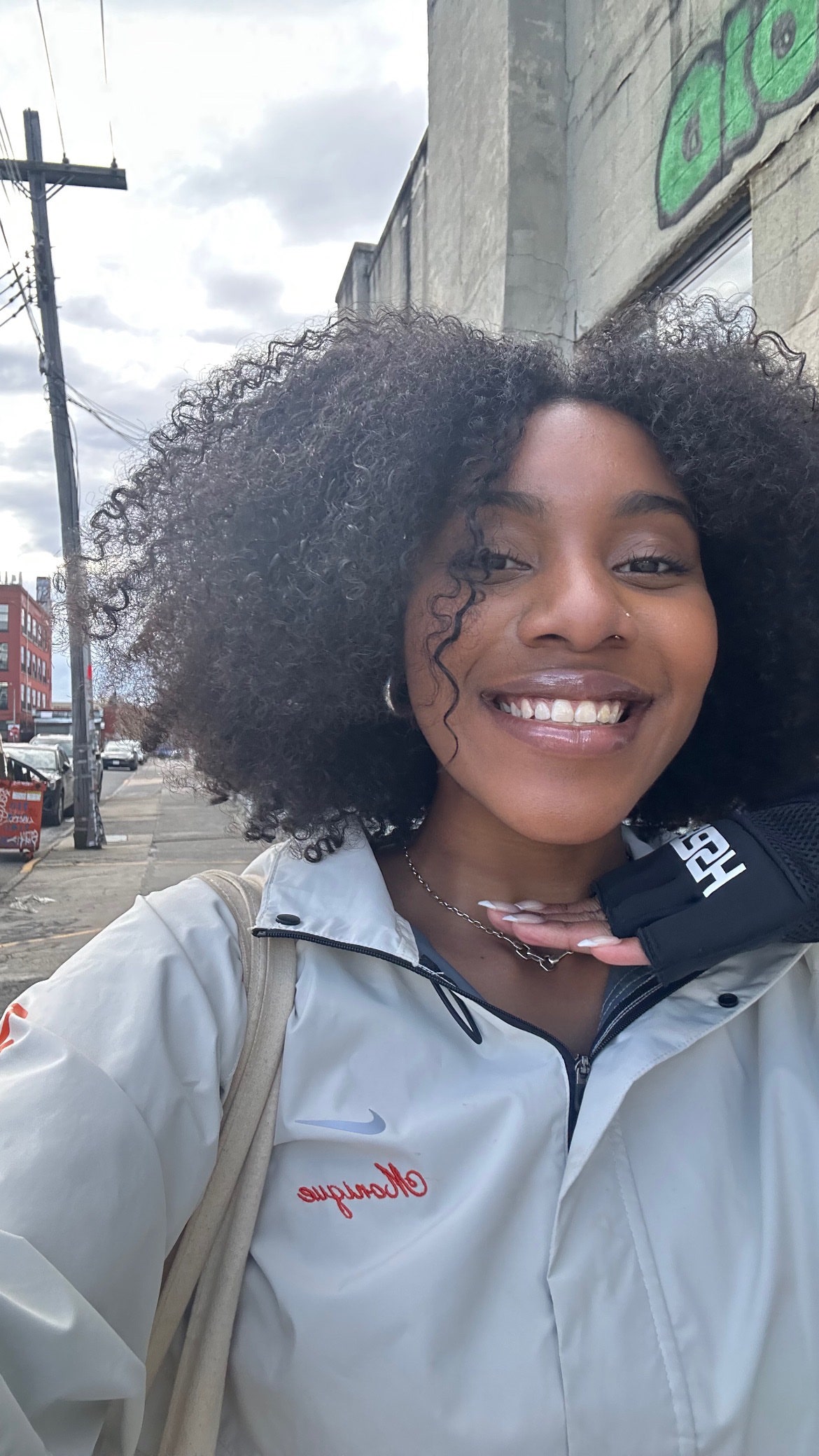 Image may contain Accessories Jewelry Necklace Person Teen Hair Curly Hair Face Head Car and Transportation