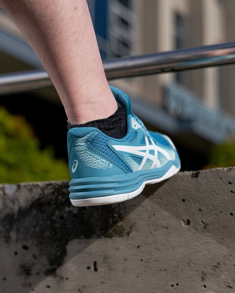 man wearing the Asics Upcourt 5