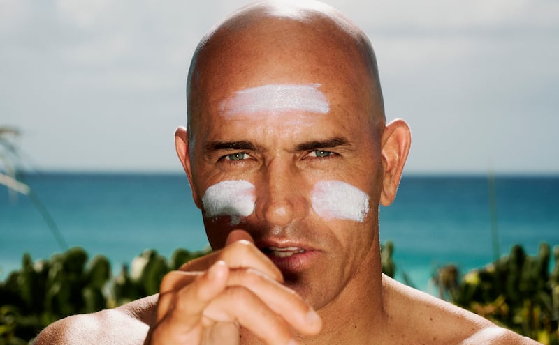 A photo of Kelly Slater with sunscreen on his face.