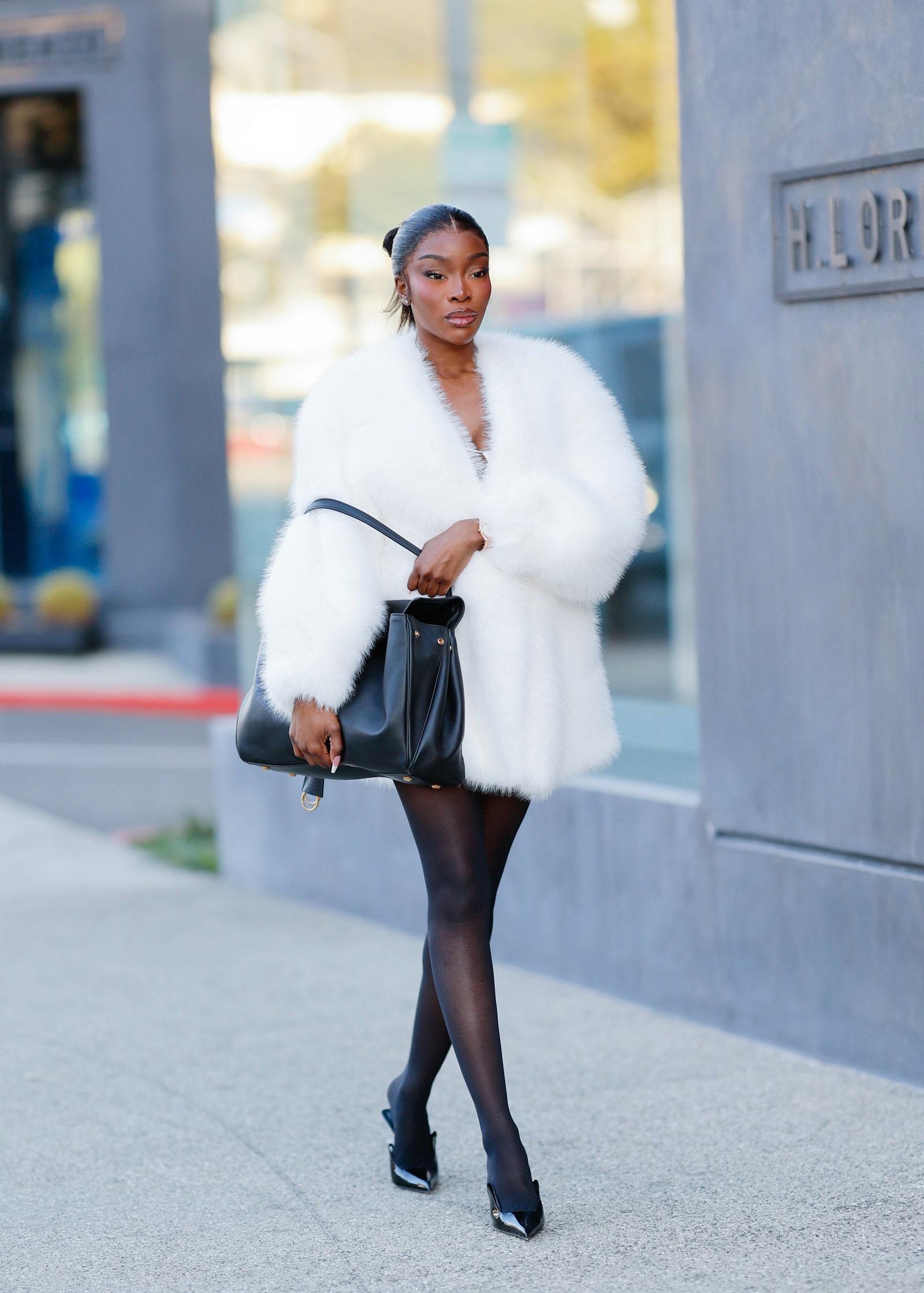 woman in faux fur coat